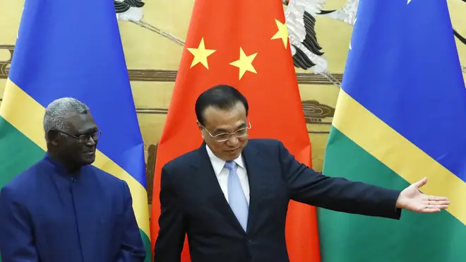 Solomon Islands Prime Minister Manasseh Sogavare, left, and Chinese Premier Li Keqiang