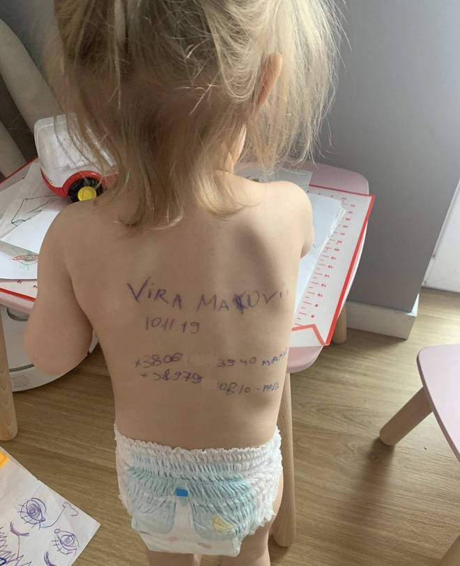 The two-year-old had a family members name and phone number scrawled on their back.
