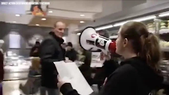 One protester shouted her message through a megaphone near the meat fridges in Waitrose