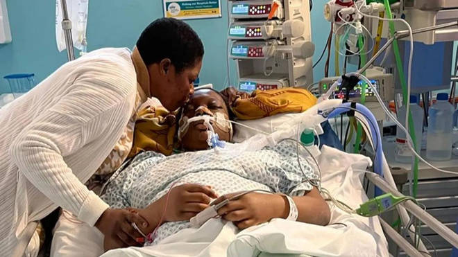 Damilola in hospital with her mum after she fell critically ill