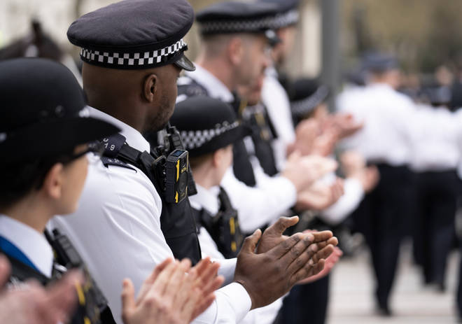 Officers applaud Cressida Dick as she leaves Scotland Yard