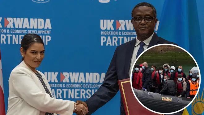 British Home Secretary Priti Patel (L), and Rwandan Minister of Foreign Affairs and International Cooperation Vincent Biruta, shake hands after signing an agreement at Kigali Convention Center.