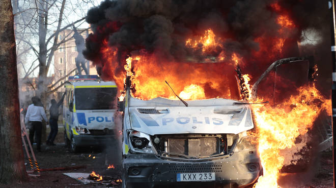 A police bus on fire