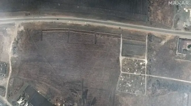 The images are thought to show a mass grave dug near Mariupol
