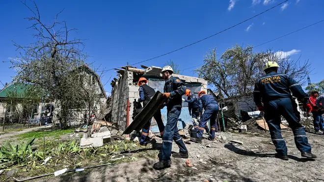 Rescue team members cleared rubble after Russian attacks