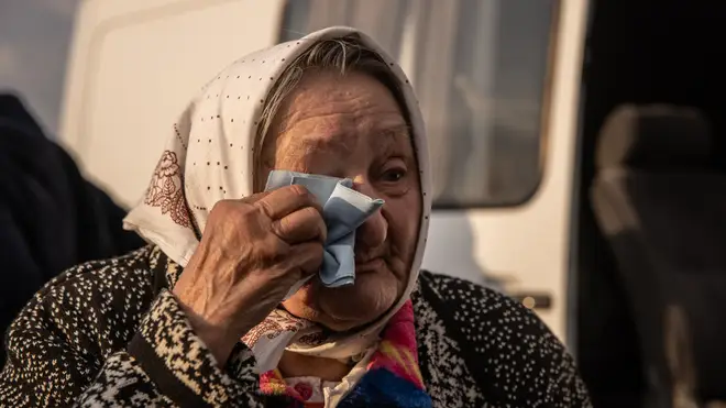 A woman from Mariupol cries after arriving at an evacuation point