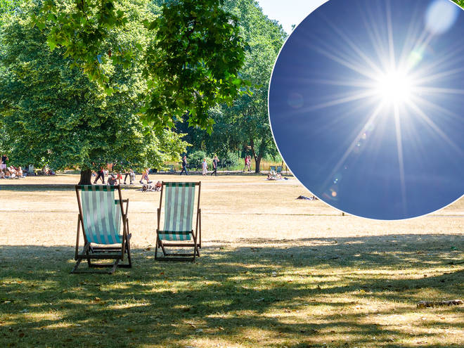 Sunny park in London with green deck chairs
