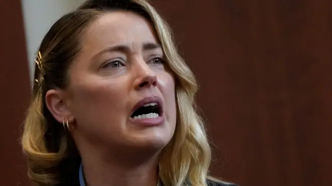 Amber Heard testifies about the first time she says her ex-husband, actor Johnny Depp, hit her.