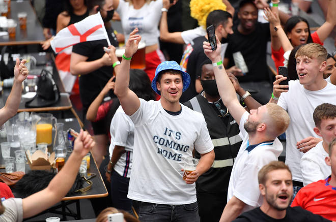 An England fan wearing an 'It's Coming Home'.