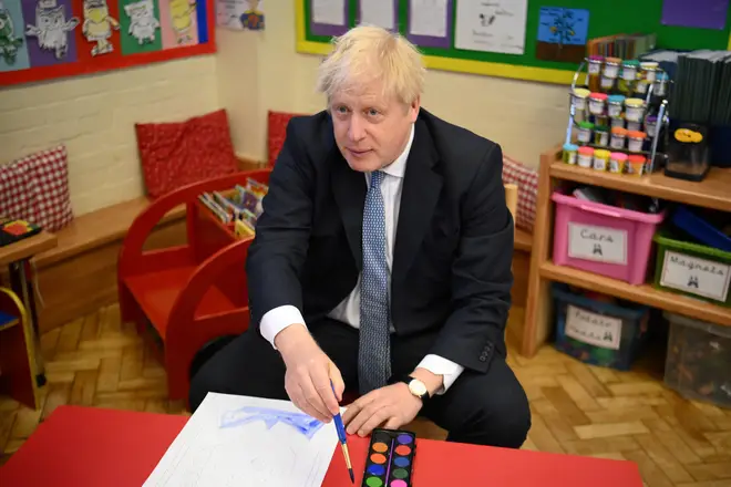 Boris Johnson visits a school after the local elections in London.