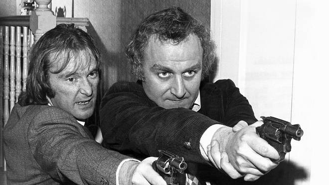 Dennis Waterman and John Thaw in rehearsals before a take on the set of the Sweeney.