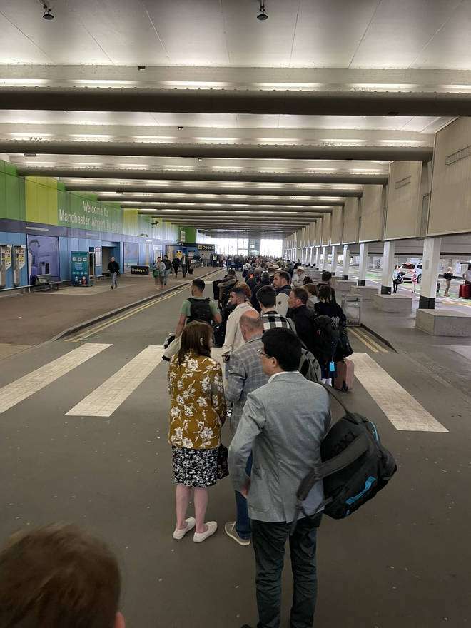 Queues at Manchester Airport stretched through the car park