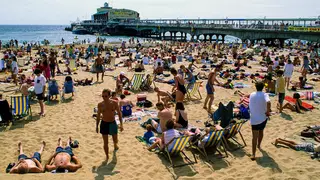 A man has been arrested on suspicion of rape after a 14-year-old boy was attacked in public toilets at Bournemouth beach.