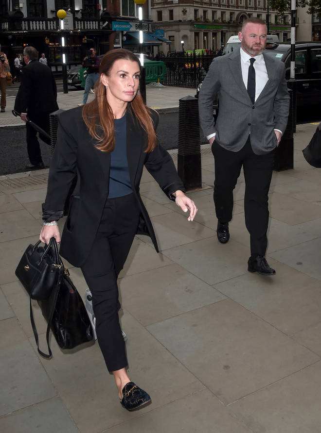 Coleen Rooney and her husband former England star Wayne Rooney arrive at court