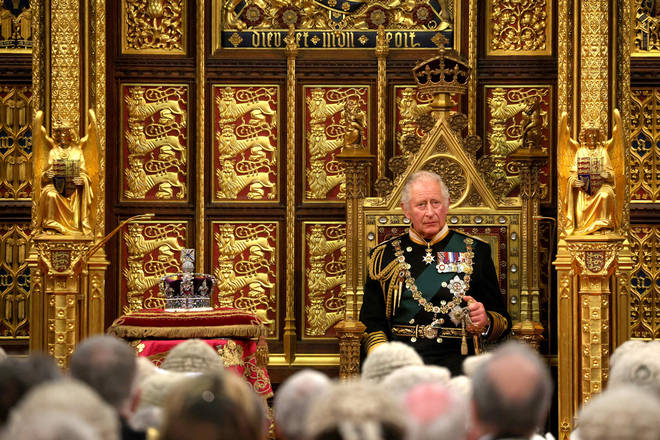 Prince Charles sat on the consort's throne, next to the Queen's Imperial State Crown