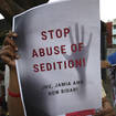A woman holds a placard protesting against a sedition case in Bangalore, India, in 2020