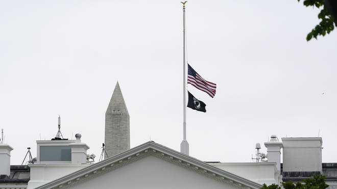 The American flag flies at half-mast at the White House