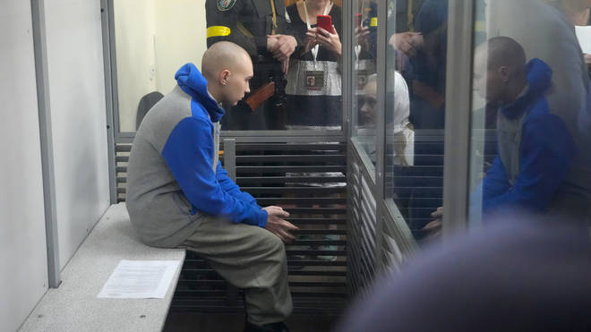 Russian Sgt Vadim Shishimarin, 21, is seen behind glass during a court hearing in Kyiv, Ukraine, on Friday May 13 2022