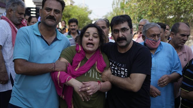 Meenakshi mourns during the cremation of her husaband Rahul Bhat, a government employee killed on Thursday, in Jammu, India