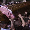 Mourners carry slain Al Jazeera veteran journalist Shireen Abu Akleh to her burial in Jerusalem