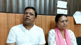Sanjeev Ranjan Prasad, a 61-year-old retired government officer, and his wife Sadhana Prasad wait at a lawyer’s chamber in Haridwar, India