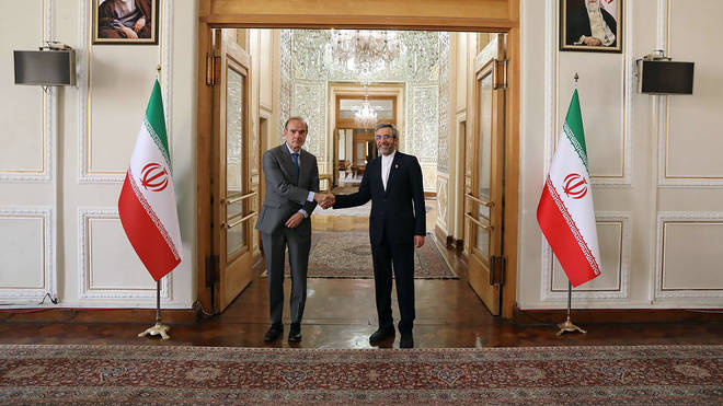 Enrique Mora, the European Union co-ordinator of talks to revive Iran’s nuclear accord with world powers, left, shakes hands with Iran’s top nuclear negotiator Ali Bagheri Kani, in Tehran