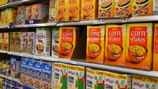 Supermarket shelves displaying breakfast cereals