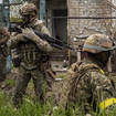Ukrainian National Guard patrol during a reconnaissance mission in a recently retaken village on the outskirts of Kharkiv, east Ukraine (Bernat Armangue/AP)