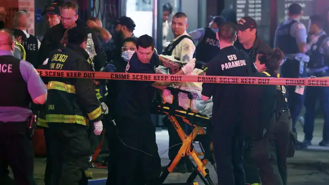 First responders move a shooting victim to an ambulance