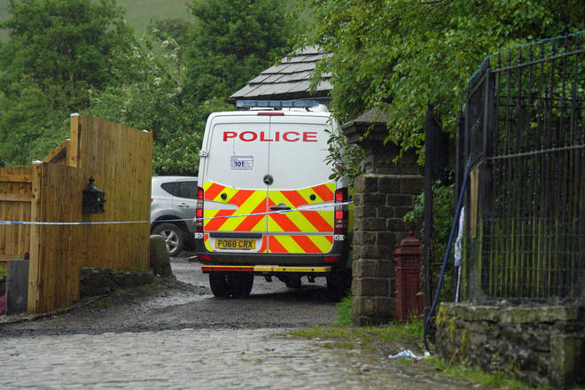 A large police presence remains at the scene in Rochdale.