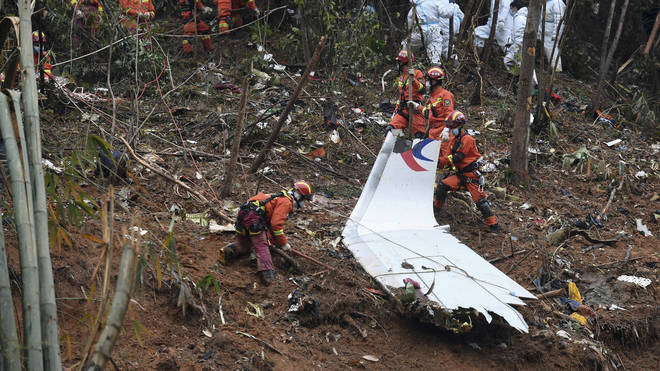 Search and rescue workers at the crash site in southern China's Guangxi Zhuang Autonomous Region