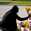 Shannon Waedell-Collins pays her respects at the scene of Saturday’s shooting at a supermarket, in Buffalo,