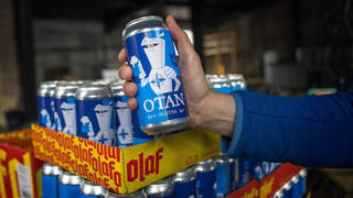 Beer cans inspired by the Nato logo by Olaf Brewing Company are displayed in Savonlinna, eastern Finland