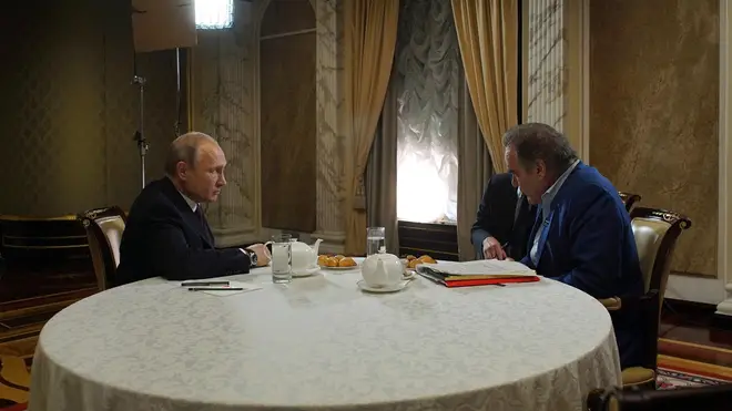 Russian President Vladimir Putin, left, listens to a question from American film director Oliver Stone during an interview at the Kremlin June 19, 2019 in Moscow, Russia.