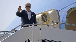 Joe Biden waves from Air Force One on his arrival in Japan