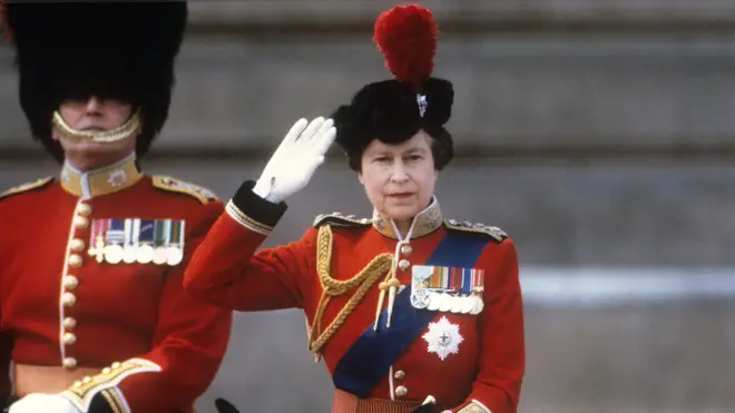 Queen Elizabeth II taking the salute of the Household Guards regiments during the Trooping of the Colour ceremony in London in 1985.