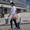 Residents pass by a quiet shopping centre area in Beijing