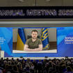 Ukrainian President Volodymyr Zelensky displayed on a screen as he addresses the audience from Kyiv on a screen during the World Economic Forum in Davos, Switzerland, on Monday May 23 2022