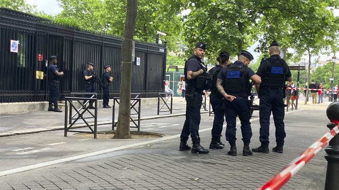 Police officers guard the entrance of the Qatar embassy on Monday May 23 2022 in Paris