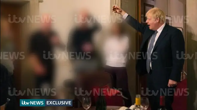 Boris Johnson was pictured raising a glass in Downing Street.