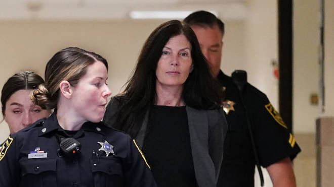 Former Pennsylvania attorney general Kathleen Kane, centre, is led to court