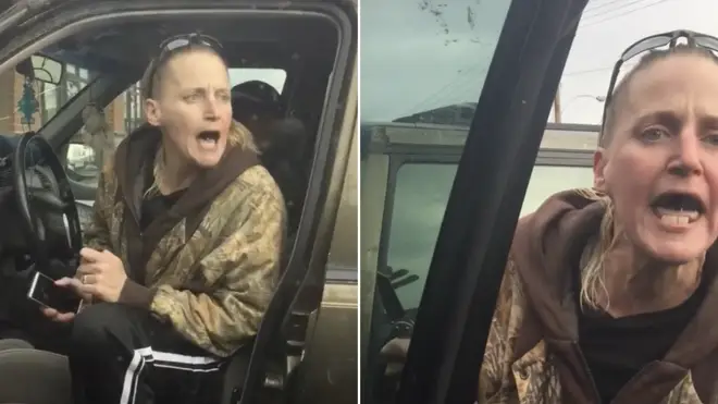 A knife wielding woman shouted racial slurs over the way a black couple parked their car