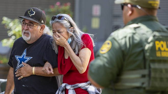 A woman cries as she leaves the Uvalde Civic Centre