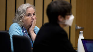 Romance writer Nancy Crampton Brophy, left, watches proceedings in court