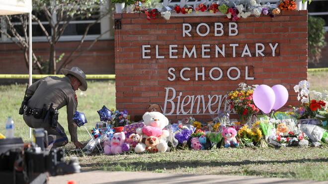 Flowers have been laid at the scene of the shooting in Uvalde, Texas.