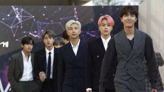 In this April 24, 2019, photo, members of South Korean K-Pop group BTS arrive to attend The Fact Music Awards in Incheon, South Korea