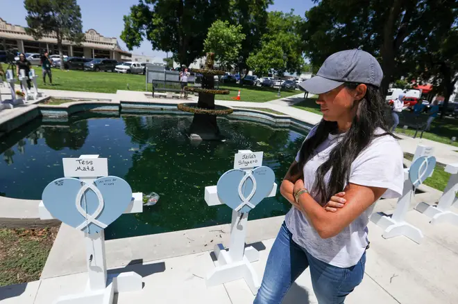 The Duchess of Sussex visits a memorial for the 21 victims of a Texas school shooting.