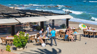 People at a beach bar in the Costa del Sol, Spain