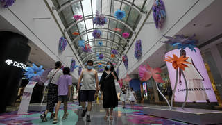 Shoppers in a reopened mall in Beijing