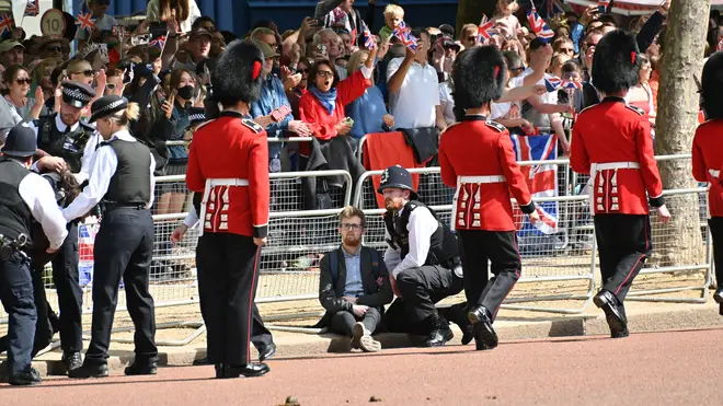 Police made arrests as protesters ran in front of the military parade down the Mall before Trooping the Colour.